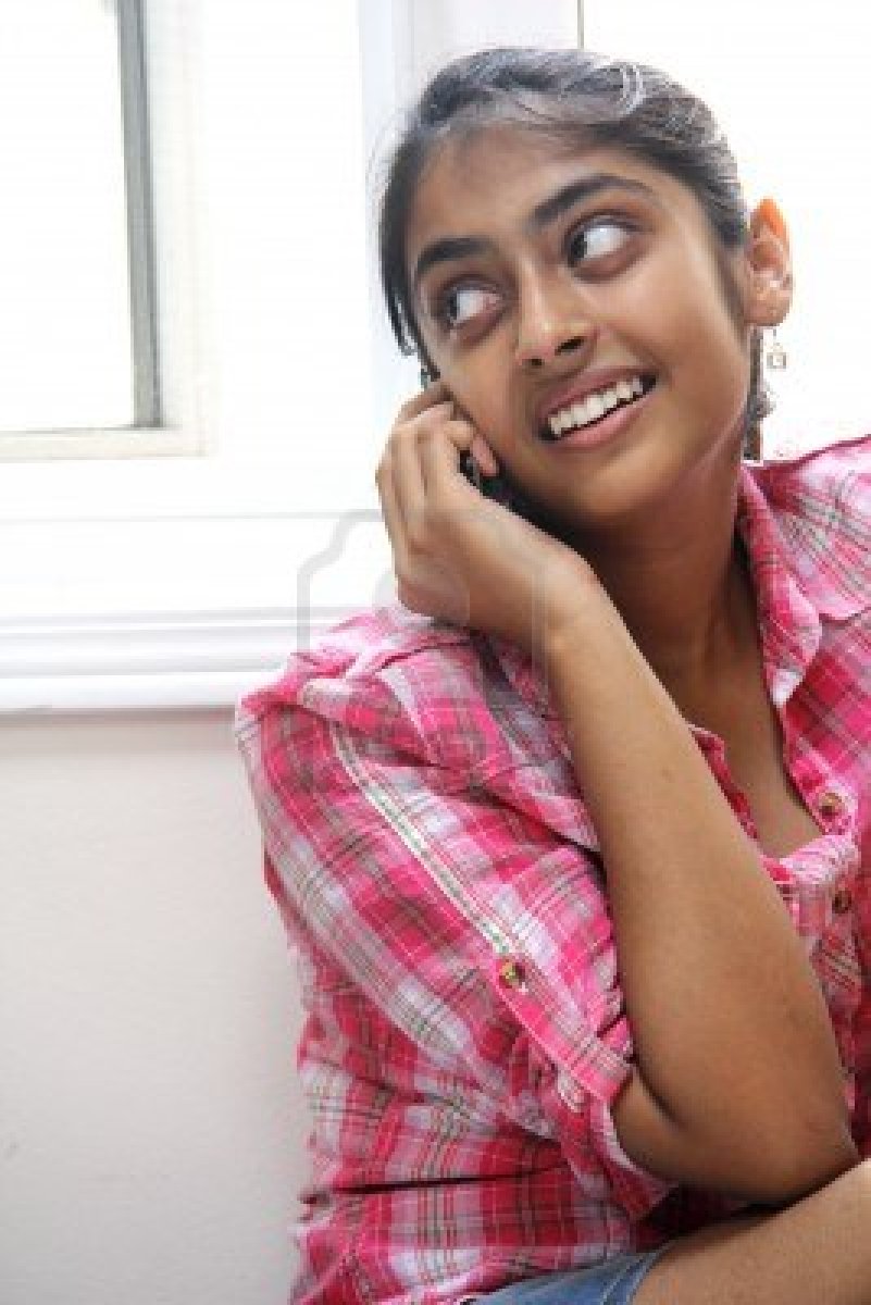 16140930-happy-young-indian-girl-using-mobile-phone.jpg